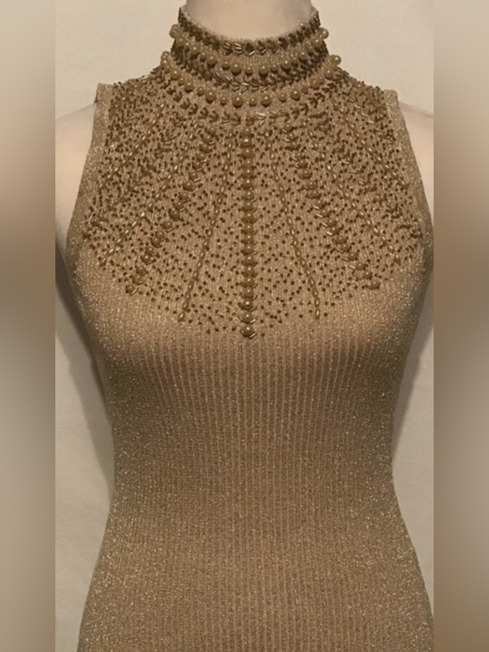 Cache Sleeveless Beaded Mock Neck Top is a size Large.